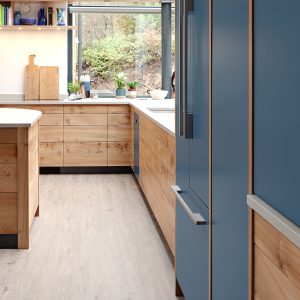 Large, high quality bespoke kitchen designed and made by HOUT in Cumbria using locally sourced Elm and Caesarstone worktops, you can feel the warmth the lovely English hardwood creates in the natural light filled room.