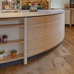 Contemporary highly bespoke solid wood Ash curved farmhouse kitchen designed and made in Cumbria by HOUT