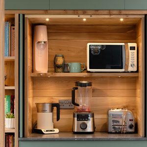 Bespoke Kitchen pocket-door appliance cupboard in handmade wooden Kitchen by HOUT