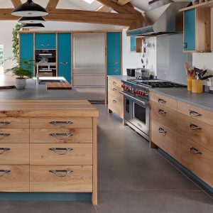 Large, high quality solid wood Elm kitchen in Cumbria with teal painted doors and Caesarstone worktop, designed and made by HOUT