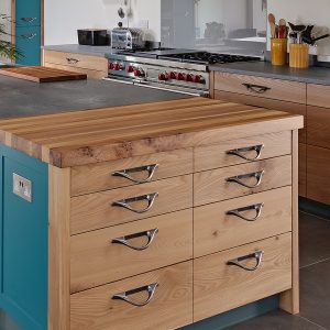 Large, high quality solid wood Elm kitchen in Cumbria with teal painted doors and Caesarstone worktop, designed and made by HOUT